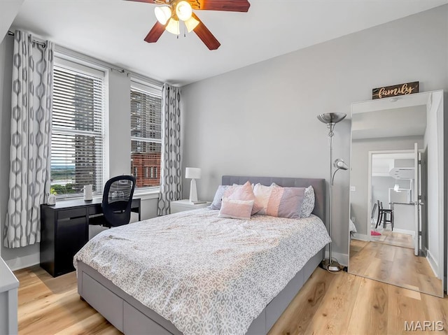 314 N Broadway Unit 1107, Saint Louis, MO 63102 - bedroom featuring light wood-style flooring and a ceiling fan