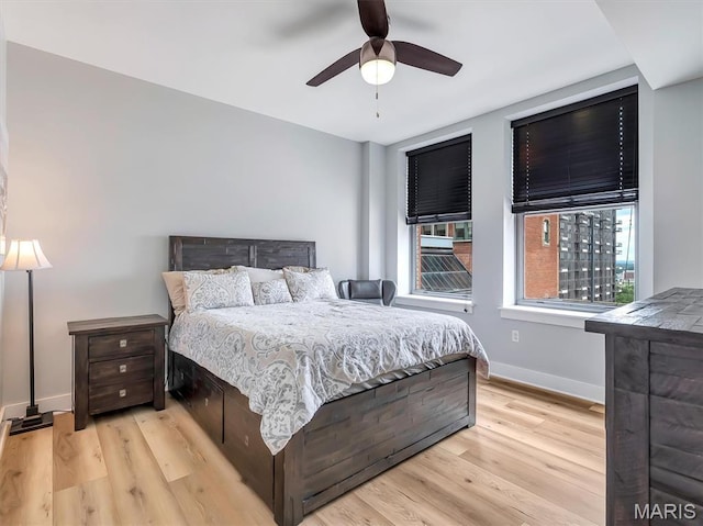314 N Broadway Unit 1107, Saint Louis, MO 63102 - bedroom with light wood finished floors and a ceiling fan