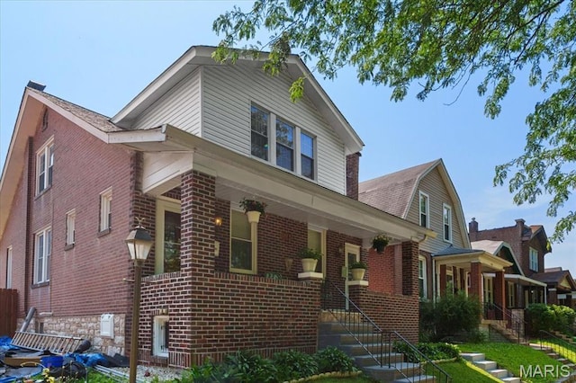 5140 Christy Ave, Saint Louis, MO 63116 - view of front facade featuring brick siding and stairs