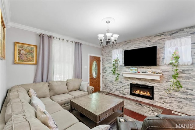 5140 Christy Ave, Saint Louis, MO 63116 - living area featuring a chandelier, a stone fireplace, wood finished floors, and ornamental molding