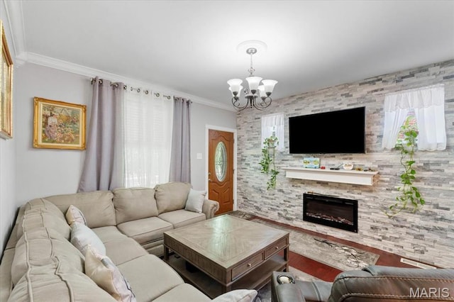 5140 Christy Ave, Saint Louis, MO 63116 - living room with a chandelier, a large fireplace, wood finished floors, and ornamental molding