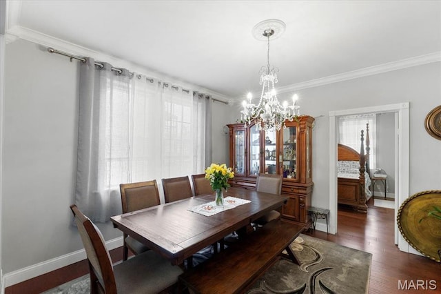5140 Christy Ave, Saint Louis, MO 63116 - dining space with healthy amount of natural light, a chandelier, ornamental molding, and wood finished floors