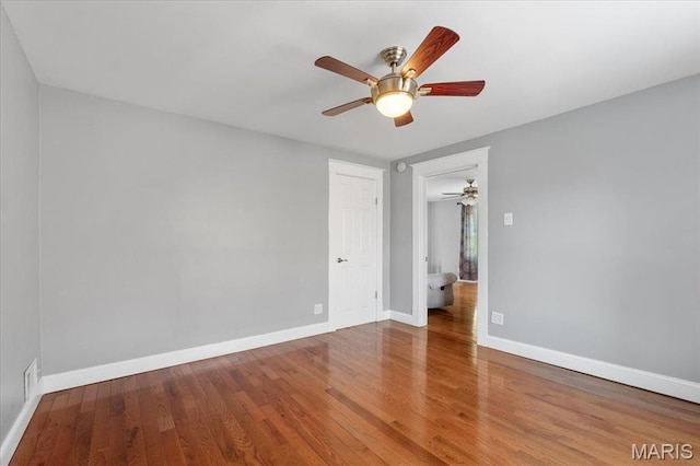 5140 Christy Ave, Saint Louis, MO 63116 - unfurnished bedroom with wood finished floors and a ceiling fan