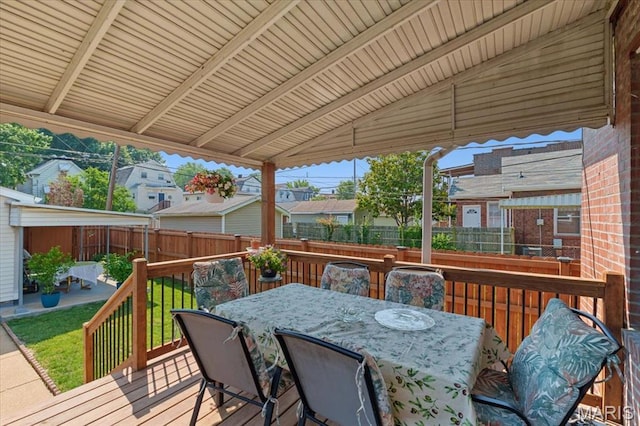 5140 Christy Ave, Saint Louis, MO 63116 - wooden terrace with a fenced backyard, outdoor dining area, and a residential view