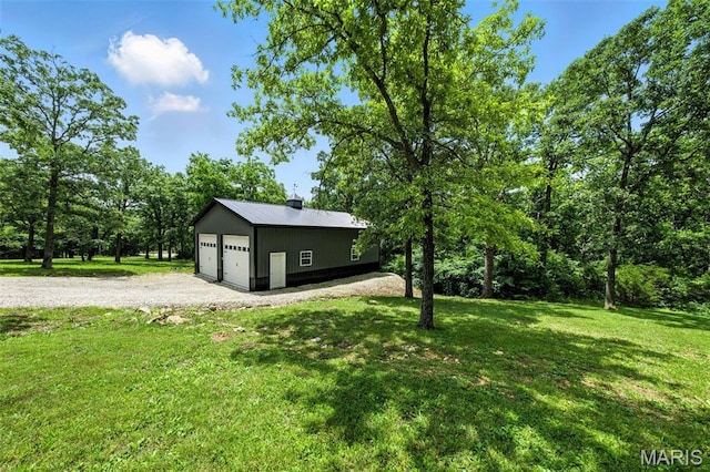 4472 Liberty Ridge Rd, De Soto, MO 63020 - view of green lawn with a garage and an outbuilding