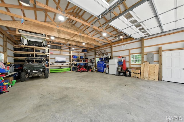 4472 Liberty Ridge Rd, De Soto, MO 63020 - garage featuring freestanding refrigerator and electric panel