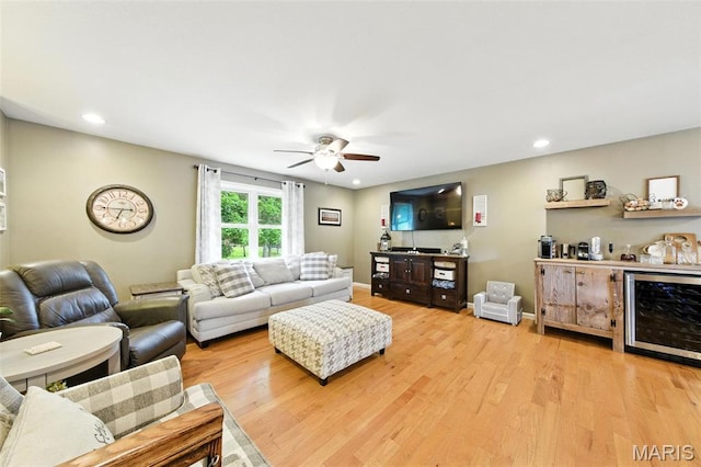 4472 Liberty Ridge Rd, De Soto, MO 63020 - living area with beverage cooler, a ceiling fan, light wood-style floors, a dry bar, and recessed lighting