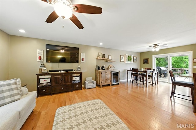 4472 Liberty Ridge Rd, De Soto, MO 63020 - living room with beverage cooler, ceiling fan, light wood finished floors, recessed lighting, and bar area