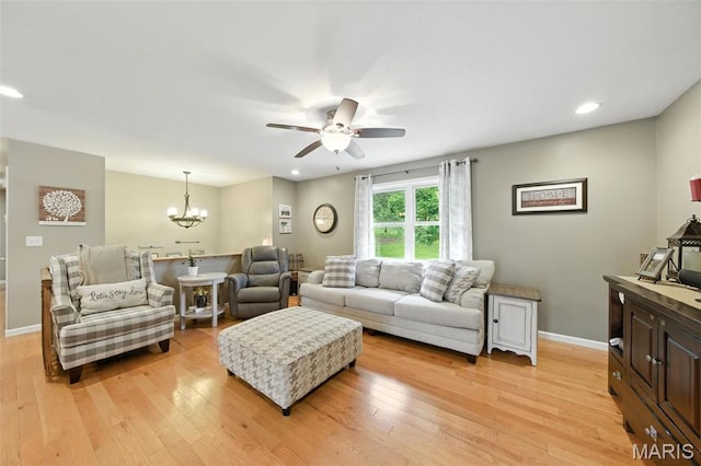 4472 Liberty Ridge Rd, De Soto, MO 63020 - living room featuring a ceiling fan, light wood-style floors, a chandelier, and recessed lighting