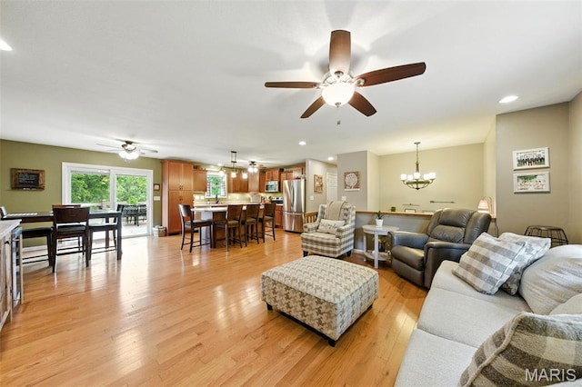 4472 Liberty Ridge Rd, De Soto, MO 63020 - living area featuring a chandelier, ceiling fan, light wood-type flooring, and recessed lighting