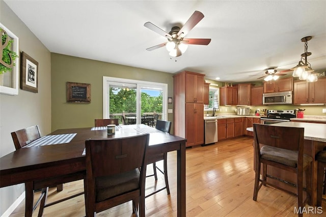 4472 Liberty Ridge Rd, De Soto, MO 63020 - dining room featuring a ceiling fan and light wood-style floors