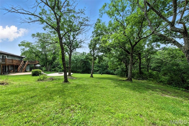 4472 Liberty Ridge Rd, De Soto, MO 63020 - view of grassy yard featuring stairway and a deck
