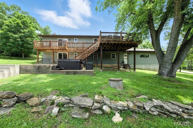 4472 Liberty Ridge Rd, De Soto, MO 63020 - rear view of house featuring a hot tub, a wooden deck, and a yard