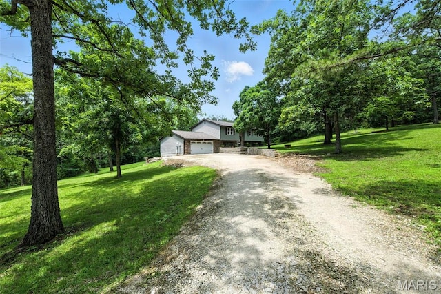 4472 Liberty Ridge Rd, De Soto, MO 63020 - split level home featuring dirt driveway, a front lawn, and an attached garage