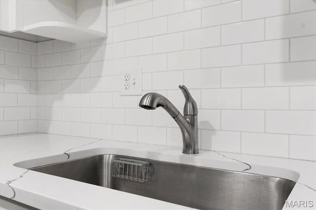 10401 Briarbend Dr Unit 2, Saint Louis, MO 63146 - kitchen view of decorative backsplash and light stone countertops
