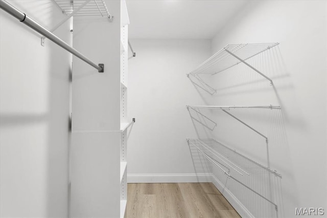 10401 Briarbend Dr Unit 2, Saint Louis, MO 63146 - spacious closet featuring wood finished floors