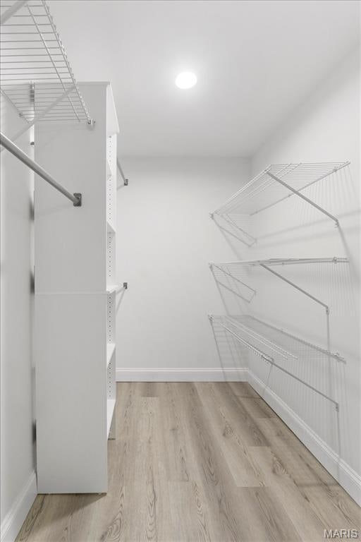 10401 Briarbend Dr Unit 2, Saint Louis, MO 63146 - walk in closet featuring wood finished floors