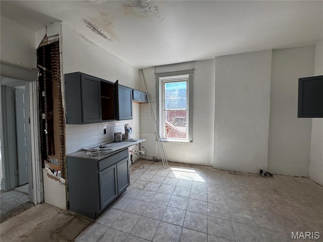 3929 Pennsylvania, Saint Louis, MO 63118 - kitchen featuring tasteful backsplash and light countertops