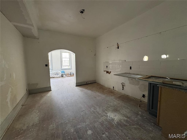 3929 Pennsylvania, Saint Louis, MO 63118 - kitchen featuring arched walkways and wood finished floors