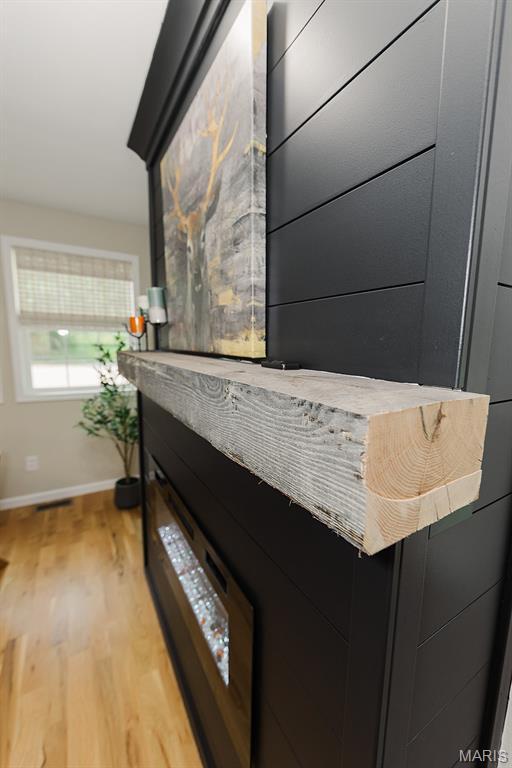 300 E 11th St, Salem, MO 65560 - detailed view of wood finished floors and baseboards