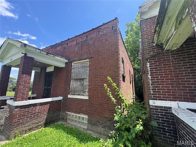 view of home's exterior with brick siding
