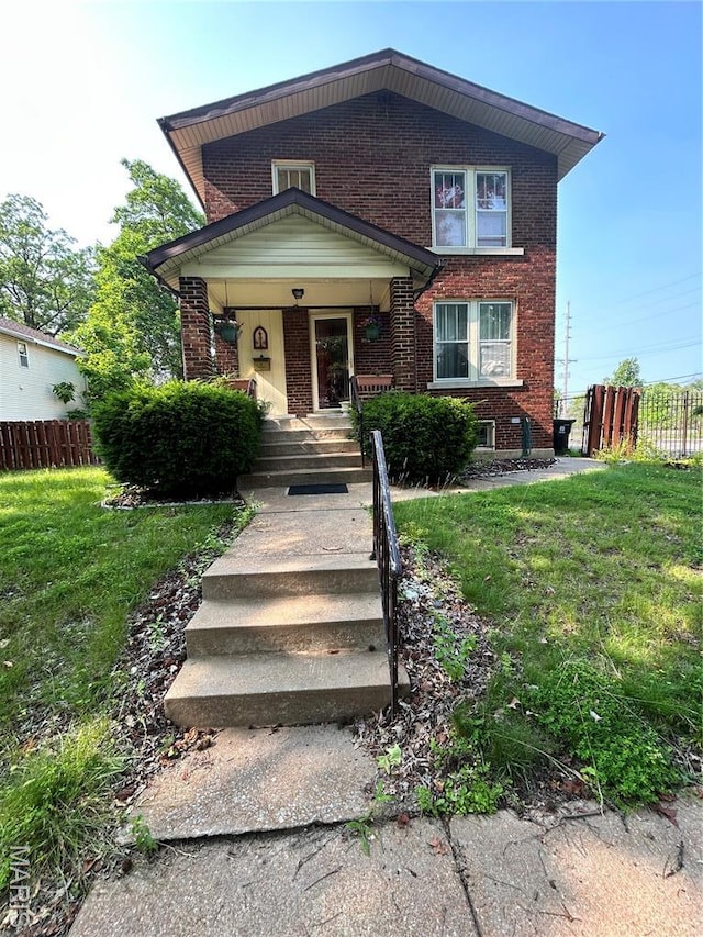 6507 Crest Ave, Saint Louis, MO 63130 - view of front facade featuring brick siding, covered porch, and stairs