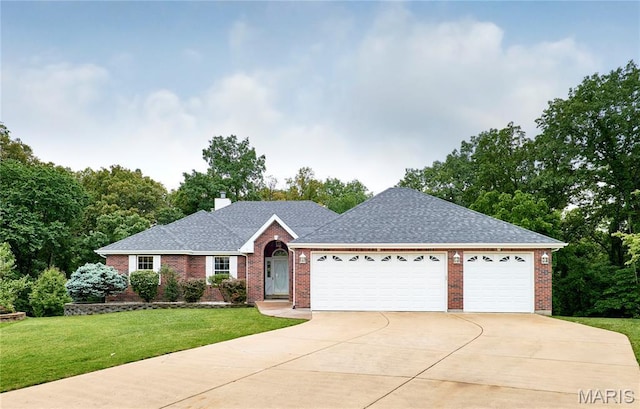 3989 Kim Kelly Dr, Harvester Township, MO 63304 - ranch-style house with brick siding, concrete driveway, an attached garage, and a front lawn