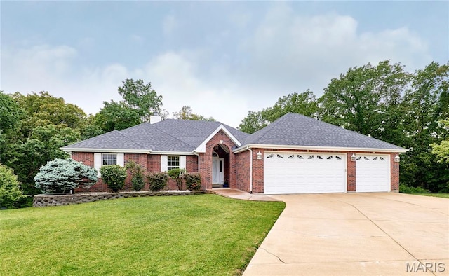 3989 Kim Kelly Dr, Harvester Township, MO 63304 - ranch-style home with brick siding, concrete driveway, an attached garage, and a front yard