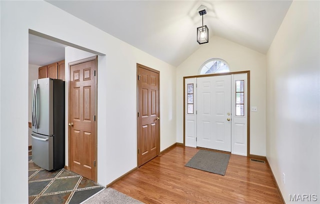 3989 Kim Kelly Dr, Harvester Township, MO 63304 - entryway with wood finished floors and lofted ceiling