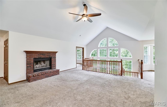 3989 Kim Kelly Dr, Harvester Township, MO 63304 - unfurnished living room featuring carpet flooring, a ceiling fan, plenty of natural light, and high vaulted ceiling