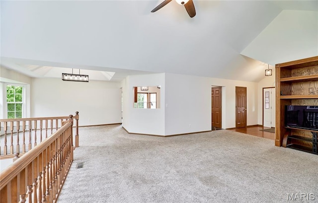 3989 Kim Kelly Dr, Harvester Township, MO 63304 - unfurnished living room featuring carpet flooring, ceiling fan, and vaulted ceiling