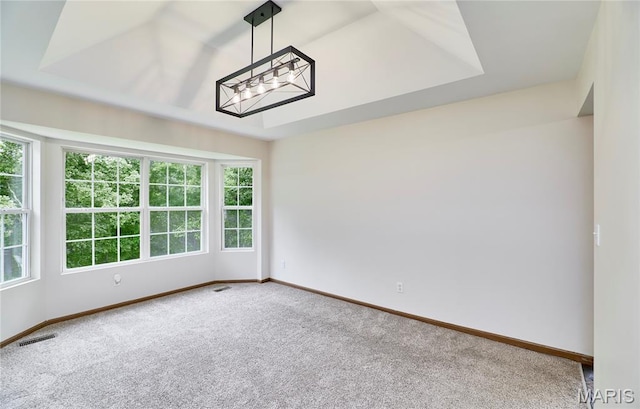 3989 Kim Kelly Dr, Harvester Township, MO 63304 - carpeted spare room featuring plenty of natural light and a chandelier