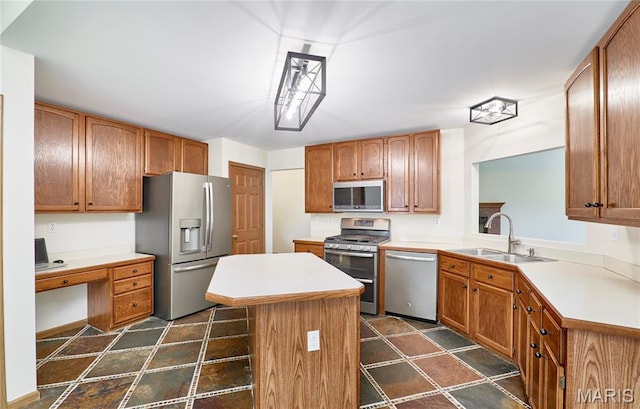 3989 Kim Kelly Dr, Harvester Township, MO 63304 - kitchen featuring stainless steel appliances, a kitchen island, light countertops, and an office area