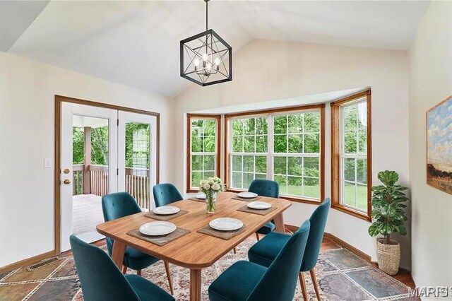 3989 Kim Kelly Dr, Harvester Township, MO 63304 - dining space with a chandelier, vaulted ceiling, and plenty of natural light