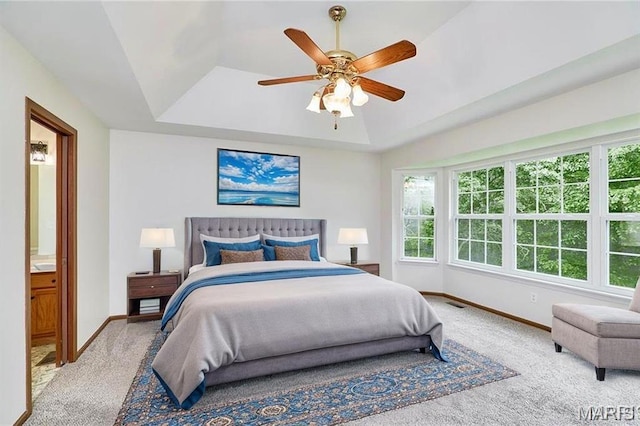3989 Kim Kelly Dr, Harvester Township, MO 63304 - carpeted bedroom with a raised ceiling, ceiling fan, and connected bathroom