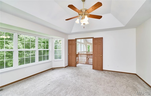 3989 Kim Kelly Dr, Harvester Township, MO 63304 - carpeted spare room featuring a tray ceiling and ceiling fan
