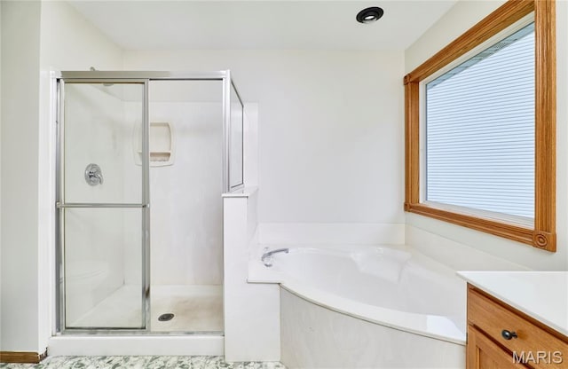 3989 Kim Kelly Dr, Harvester Township, MO 63304 - full bathroom with a shower stall, a bath, and vanity
