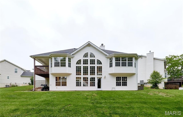 3989 Kim Kelly Dr, Harvester Township, MO 63304 - rear view of property featuring a chimney, a lawn, and a balcony