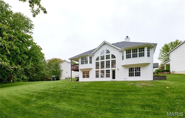 3989 Kim Kelly Dr, Harvester Township, MO 63304 - rear view of property featuring a lawn and a chimney