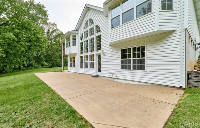 3989 Kim Kelly Dr, Harvester Township, MO 63304 - rear view of house featuring a patio and a yard
