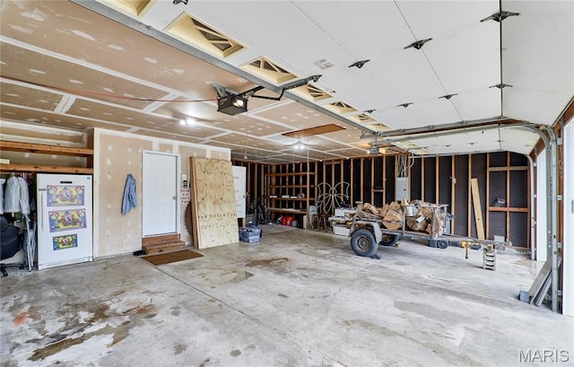 3989 Kim Kelly Dr, Harvester Township, MO 63304 - garage featuring a garage door opener