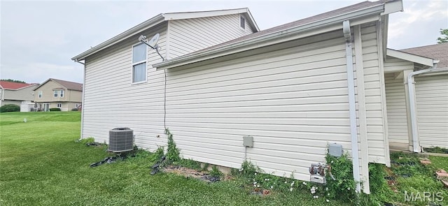 14417 Cape Charles Ct, Florissant, MO 63034 - view of side of property featuring a yard and a central air condition unit