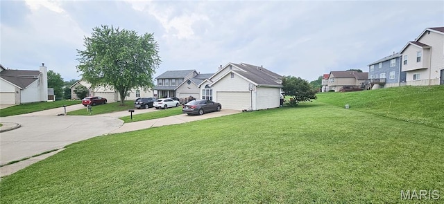 14417 Cape Charles Ct, Florissant, MO 63034 - view of grassy yard with a residential view, driveway, and a garage
