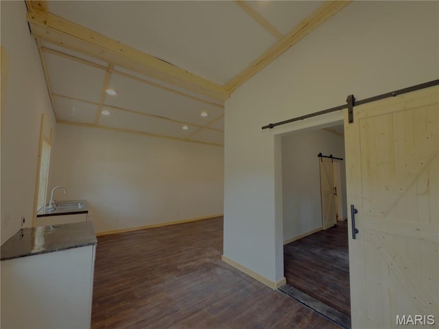 109 Preston St, Crocker, MO 65452 - unfurnished room featuring a barn door, dark wood-style flooring, and recessed lighting
