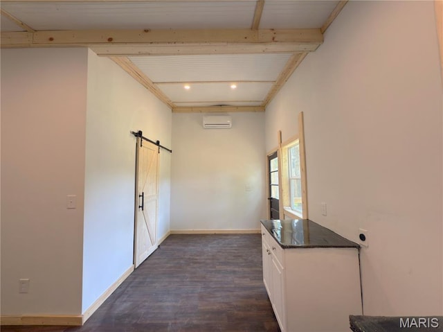 109 Preston St, Crocker, MO 65452 - corridor featuring a barn door, a wall mounted air conditioner, beamed ceiling, and dark wood-style flooring