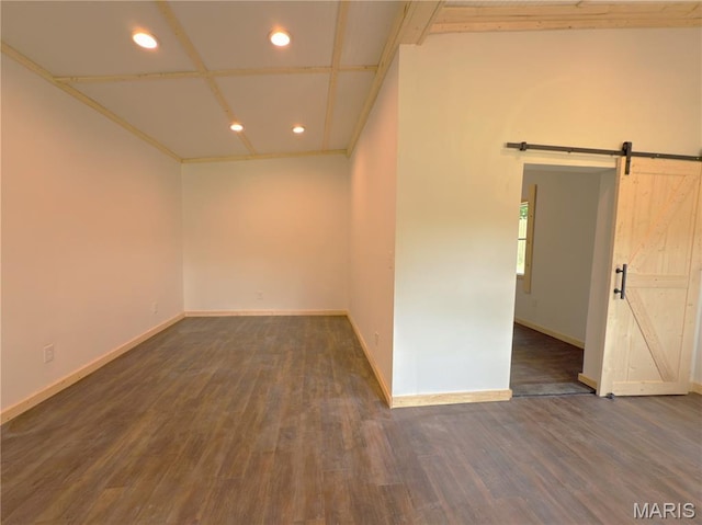109 Preston St, Crocker, MO 65452 - unfurnished room with a barn door, recessed lighting, and wood finished floors