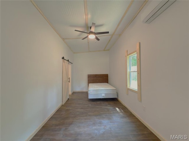 109 Preston St, Crocker, MO 65452 - unfurnished bedroom with an AC wall unit, a barn door, wood finished floors, and a ceiling fan