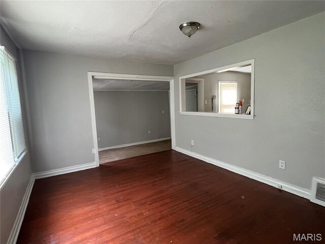 605 Abston Ave, Saint Louis, MO 63135 - unfurnished room featuring wood finished floors and baseboards