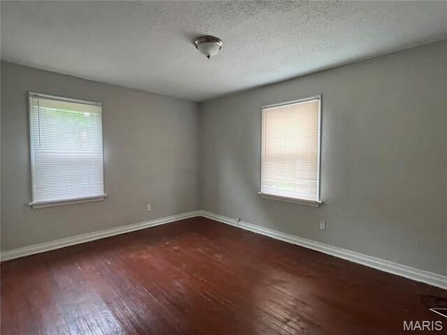 605 Abston Ave, Saint Louis, MO 63135 - spare room with hardwood / wood-style floors and baseboards