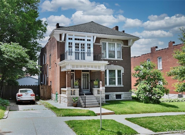 5322 Lansdowne Ave, Saint Louis, MO 63109 - view of front of property featuring a balcony, brick siding, a chimney, and a porch